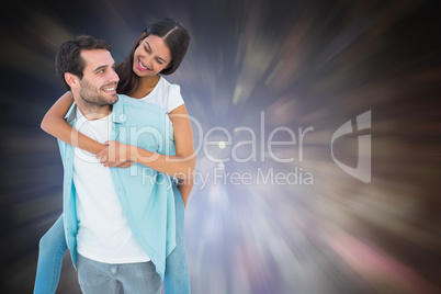 Composite image of happy casual man giving pretty girlfriend pig