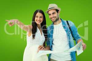 Composite image of happy hipster couple looking at map