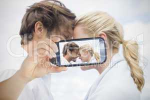 Couple taking selfie on smartphone