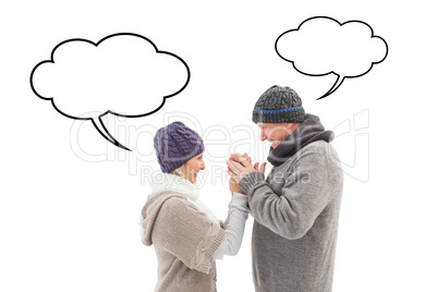 Composite image of happy mature couple in winter clothes embraci Composite image of happy mature couple in winter clothes embraci