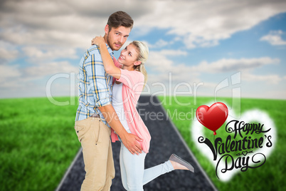 Composite image of handsome man hugging his girlfriend