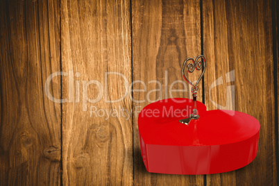 Bright red heart shaped lock with key