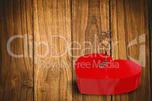 Bright red heart shaped lock with key