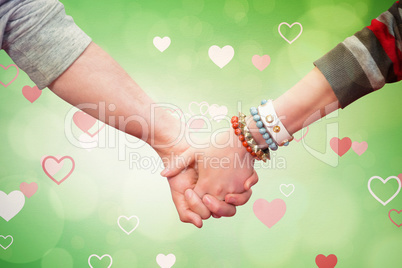 Composite image of students holding hands