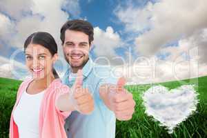 Composite image of happy couple showing thumbs up