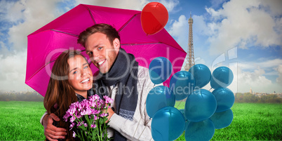 Composite image of cheerful young couple with flowers and umbrel