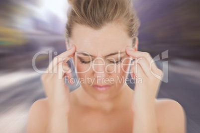 Composite image of woman with headache