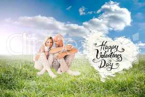 Composite image of happy couple sitting holding mugs