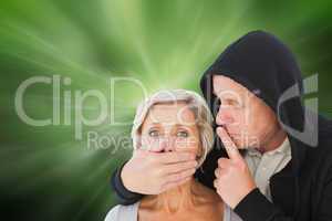 Composite image of older man silencing his fearful partner