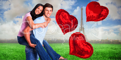 Composite image of young man giving girlfriend a piggyback ride