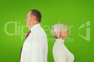 Composite image of older couple standing not facing each other