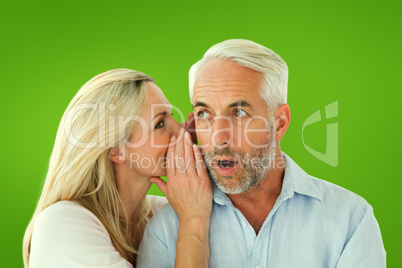 Composite image of woman whispering a secret to husband