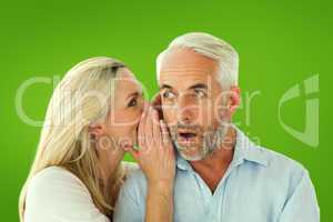 Composite image of woman whispering a secret to husband