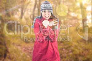 Composite image of cold redhead wearing coat and hat