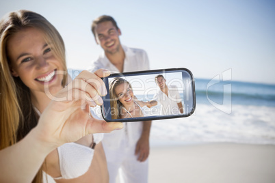 Couple taking selfie on smartphone