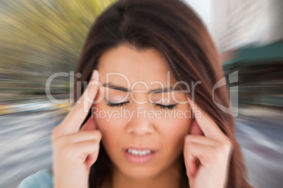 Composite image of woman with headache