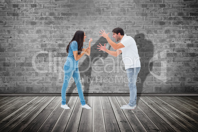 Composite image of angry couple shouting at each other