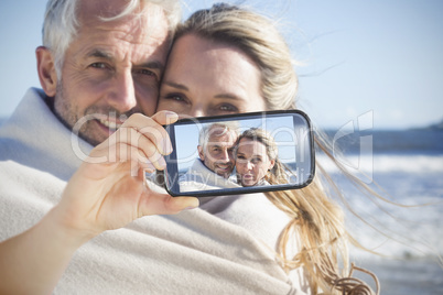 Couple taking selfie on smartphone