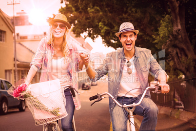 Hip young couple going for a bike ride