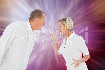 Composite image of angry older couple arguing with each other