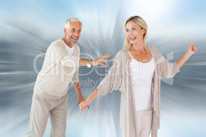 Composite image of happy couple messing about together