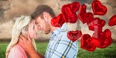 Composite image of attractive couple smiling at each other