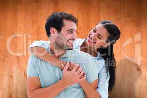 Composite image of cute couple smiling at each other