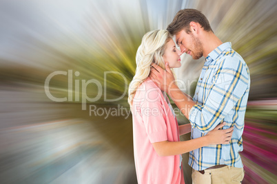 Composite image of attractive couple smiling at each other and h