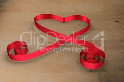 Large red ribbon in a heart shape