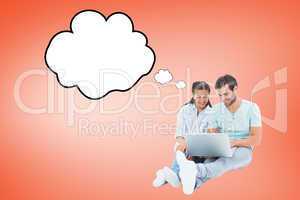 Composite image of cute couple sitting using the laptop