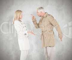 Composite image of angry couple fighting in trench coats
