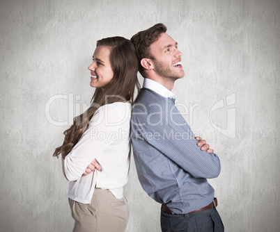 Composite image of happy young couple standing back to back