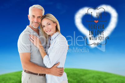 Composite image of happy couple standing and smiling at camera