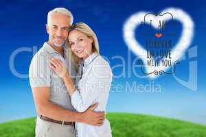 Composite image of happy couple standing and smiling at camera