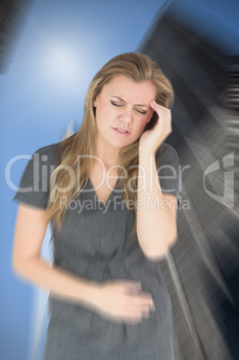 Composite image of woman with stomach ache