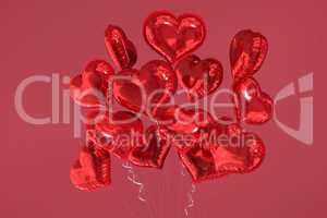 Composite image of heart balloons