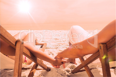 Couple resting on deck chairs