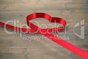 Large red ribbon in a heart shape