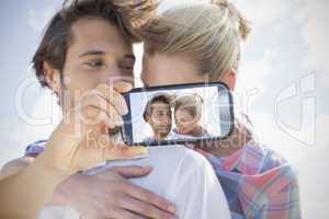 Couple taking selfie on smartphone