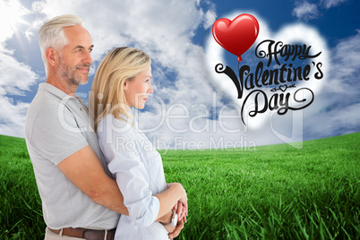 Composite image of happy couple smiling and embracing