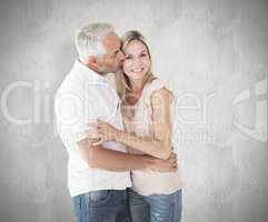 Composite image of affectionate man kissing his wife on the chee