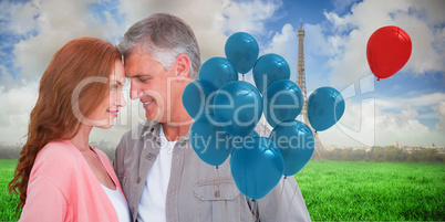 Composite image of casual couple hugging and smiling