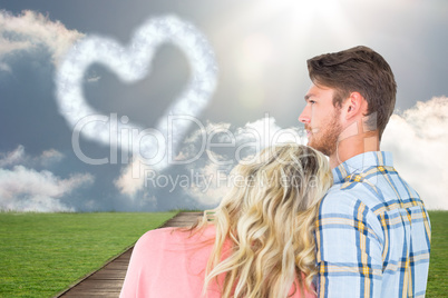Composite image of attractive young couple looking together