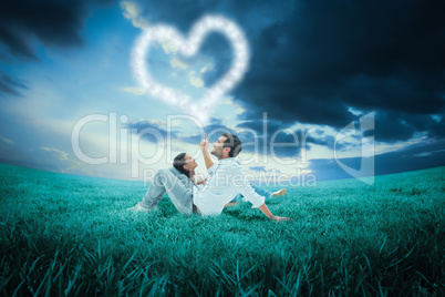 Composite image of attractive young couple lying down