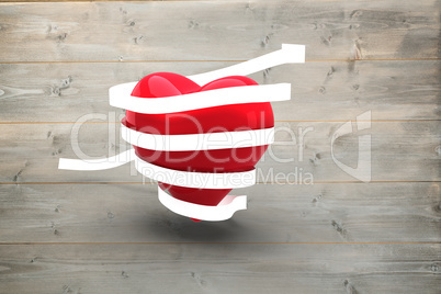 Composite image of love heart wrapped in ribbon