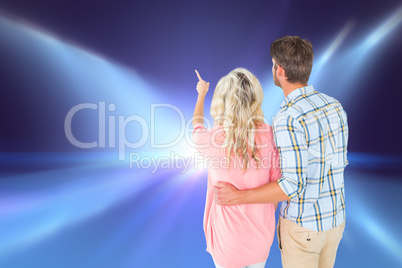 Composite image of attractive couple standing and looking