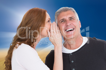 Composite image of woman telling secret to her partner