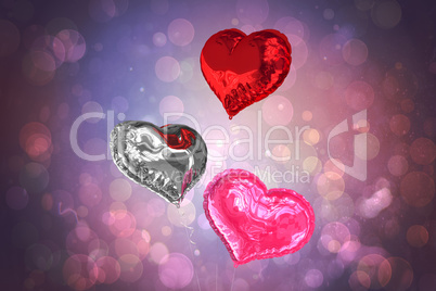 Composite image of love heart balloons