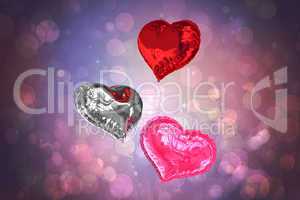 Composite image of love heart balloons