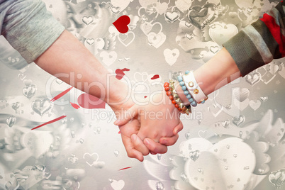 Composite image of students holding hands